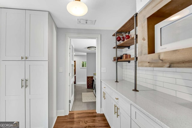 14905 Thompson Rd, Milton, GA 30004 - hallway featuring dark tile patterned flooring