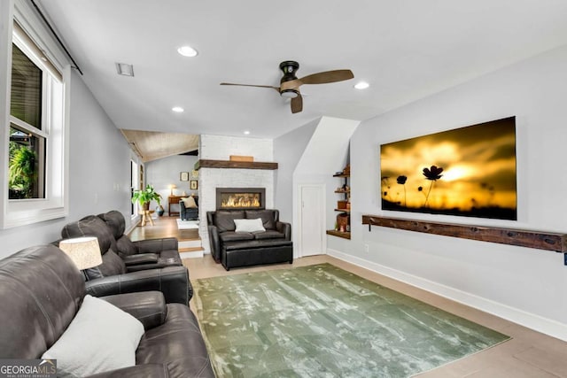 14905 Thompson Rd, Milton, GA 30004 - living room featuring a ceiling fan, recessed lighting, baseboards, a fireplace, and vaulted ceiling