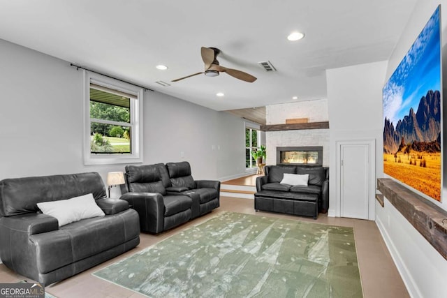 14905 Thompson Rd, Milton, GA 30004 - living area with recessed lighting, ceiling fan, a fireplace, and baseboards