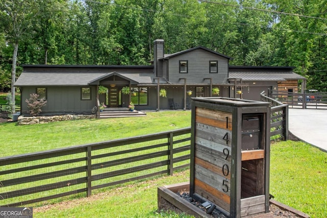 14905 Thompson Rd, Milton, GA 30004 - view of front of home with a chimney and board and batten siding