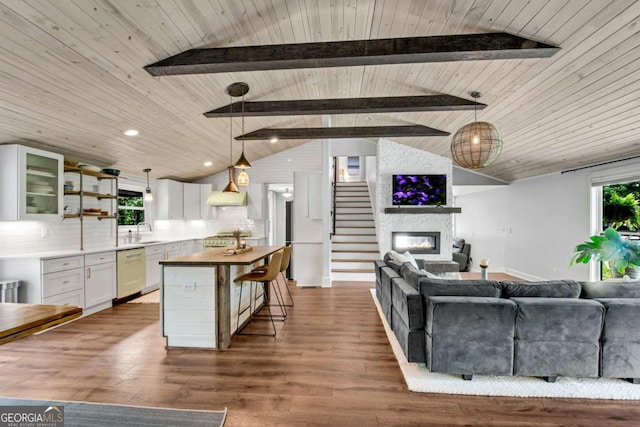 14905 Thompson Rd, Milton, GA 30004 - living area featuring wood ceiling, a large fireplace, dark wood finished floors, stairway, and recessed lighting