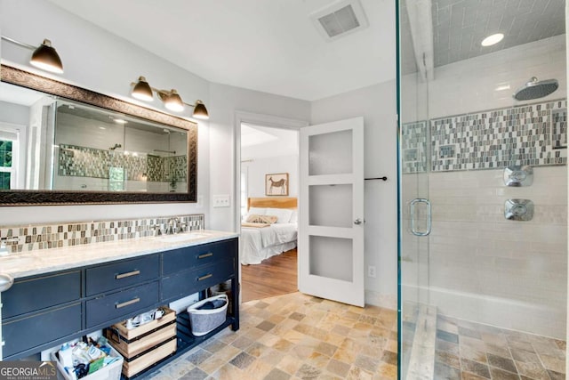 14905 Thompson Rd, Milton, GA 30004 - full bath featuring a shower stall, double vanity, connected bathroom, stone finish floors, and recessed lighting