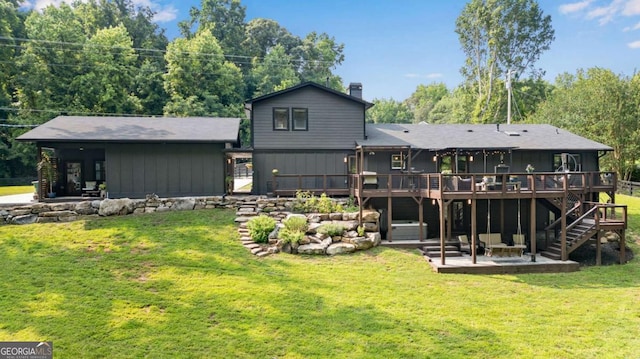 14905 Thompson Rd, Milton, GA 30004 - rear view of property with a patio area, a wooden deck, stairs, a chimney, and a lawn