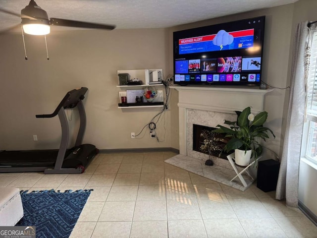 4678 Browns Mill Ferry Rd, Lithonia, GA 30038 - exercise area with ceiling fan, a premium fireplace, tile patterned floors, and baseboards