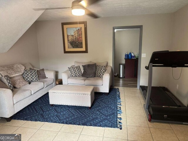 4678 Browns Mill Ferry Rd, Lithonia, GA 30038 - living room featuring tile patterned floors, a textured ceiling, and a ceiling fan