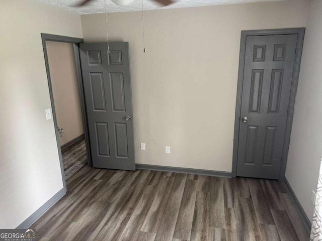 4678 Browns Mill Ferry Rd, Lithonia, GA 30038 - spare room featuring wood finished floors, ceiling fan, and baseboards