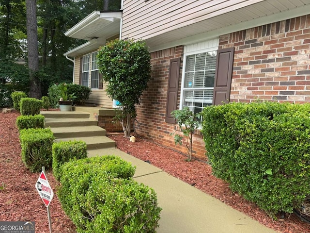4678 Browns Mill Ferry Rd, Lithonia, GA 30038 - view of exterior entry featuring brick siding