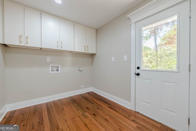 4446 Huntington Cir, Atlanta, GA 30338 - laundry area with cabinet space, washer hookup, and wood finished floors