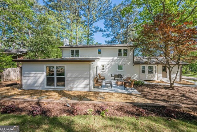 4446 Huntington Cir, Atlanta, GA 30338 - rear view of property featuring a patio area and a chimney