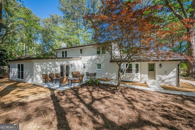 4446 Huntington Cir, Atlanta, GA 30338 - back of house with french doors, a patio area, and stucco siding