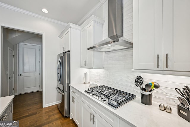 20056 Windalier Way, Roswell, GA 30076 - kitchen featuring wall chimney exhaust hood, appliances with stainless steel finishes, crown molding, baseboards, and backsplash