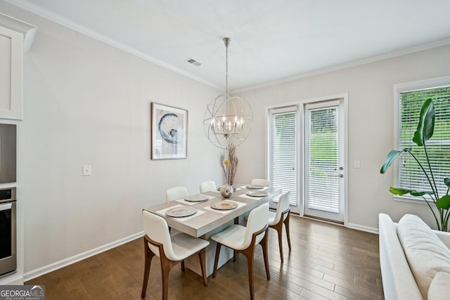 20056 Windalier Way, Roswell, GA 30076 - dining space with ornamental molding, dark wood finished floors, a chandelier, and baseboards
