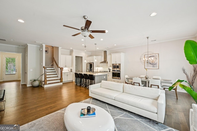 20056 Windalier Way, Roswell, GA 30076 - living room featuring stairs, crown molding, a ceiling fan, dark wood-type flooring, and baseboards
