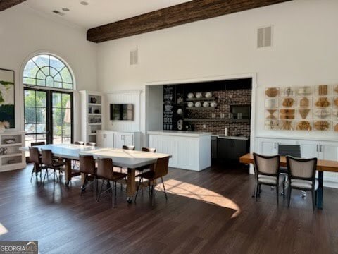 20056 Windalier Way, Roswell, GA 30076 - dining area featuring a towering ceiling, dark wood finished floors, and beam ceiling
