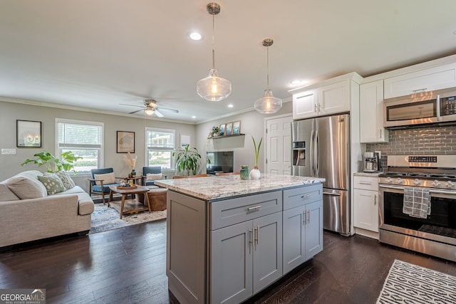 205 Plantation Rd SW, Smyrna, GA 30082 - kitchen with appliances with stainless steel finishes, open floor plan, crown molding, gray cabinetry, and white cabinets