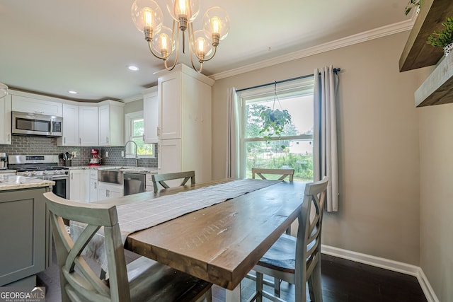 205 Plantation Rd SW, Smyrna, GA 30082 - dining space featuring baseboards, dark wood-type flooring, a chandelier, crown molding, and recessed lighting