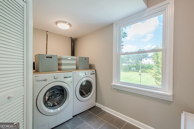 205 Plantation Rd SW, Smyrna, GA 30082 - laundry area with washer and clothes dryer, dark tile patterned flooring, and baseboards