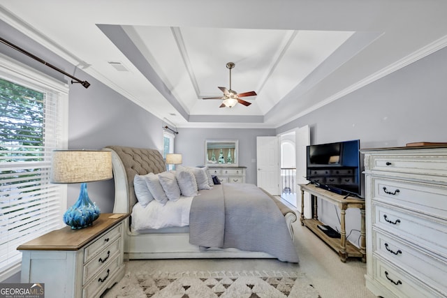 3535 Fairgreen Ct, Douglasville, GA 30135 - bedroom featuring a raised ceiling, ornamental molding, multiple windows, ceiling fan, and light carpet