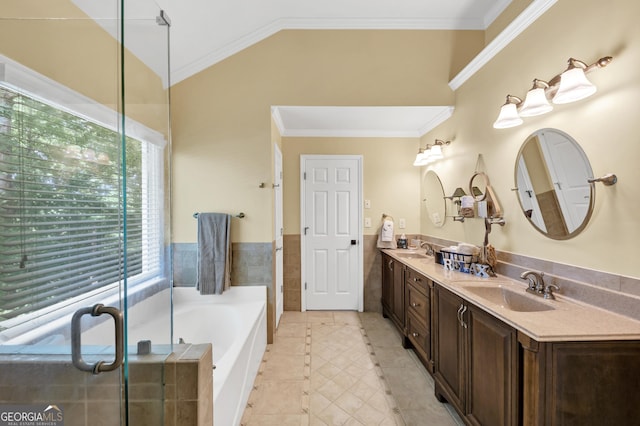 3535 Fairgreen Ct, Douglasville, GA 30135 - full bathroom featuring tile patterned flooring, double vanity, a garden tub, vaulted ceiling, and crown molding