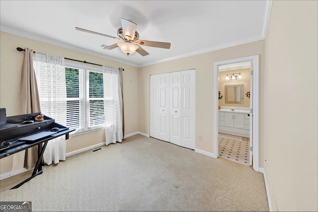 3535 Fairgreen Ct, Douglasville, GA 30135 - carpeted bedroom featuring baseboards, crown molding, a closet, ceiling fan, and ensuite bath
