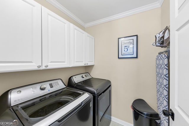 3535 Fairgreen Ct, Douglasville, GA 30135 - laundry area featuring cabinet space, independent washer and dryer, crown molding, and baseboards