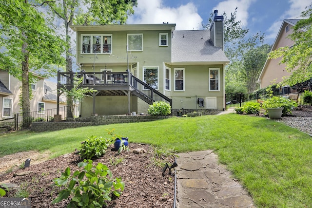 3535 Fairgreen Ct, Douglasville, GA 30135 - rear view of house featuring stairway, a wooden deck, and a chimney