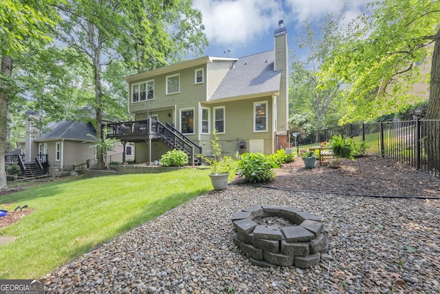 3535 Fairgreen Ct, Douglasville, GA 30135 - back of house featuring stairs, an outdoor fire pit, a deck, and a chimney