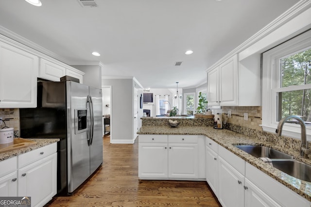 3535 Fairgreen Ct, Douglasville, GA 30135 - kitchen featuring a sink, stainless steel refrigerator with ice dispenser, a peninsula, white cabinets, and recessed lighting