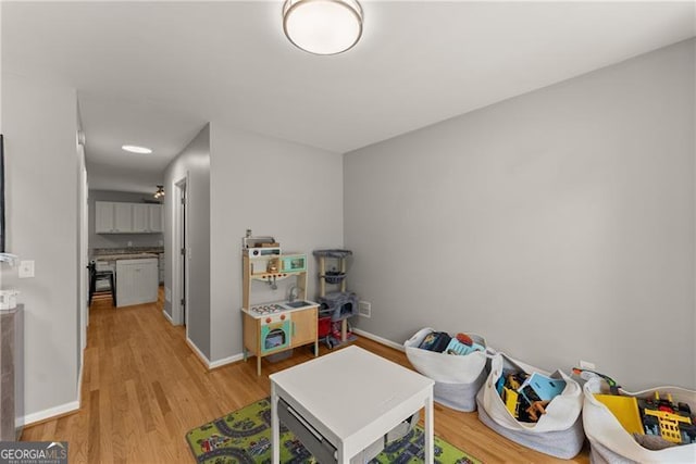5510 Pilgrim Point Ext, Cumming, GA 30041 - rec room with light wood-type flooring and baseboards
