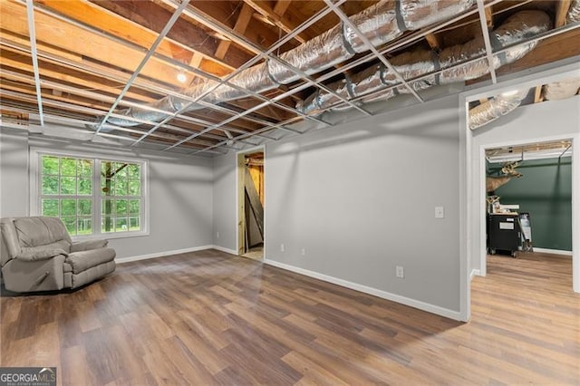 5510 Pilgrim Point Ext, Cumming, GA 30041 - basement with baseboards and wood finished floors