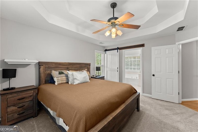 5510 Pilgrim Point Ext, Cumming, GA 30041 - bedroom featuring a tray ceiling, carpet floors, baseboards, and a ceiling fan