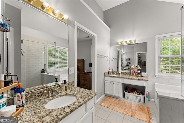 5510 Pilgrim Point Ext, Cumming, GA 30041 - full bathroom with vanity, tile patterned floors, healthy amount of natural light, tiled shower, and vaulted ceiling