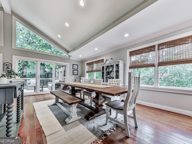 646 Darlington Cir NE, Atlanta, GA 30305 - dining room with crown molding, healthy amount of natural light, vaulted ceiling, light wood-style flooring, and recessed lighting