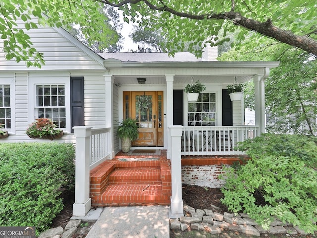 646 Darlington Cir NE, Atlanta, GA 30305 - property entrance featuring a chimney and a porch