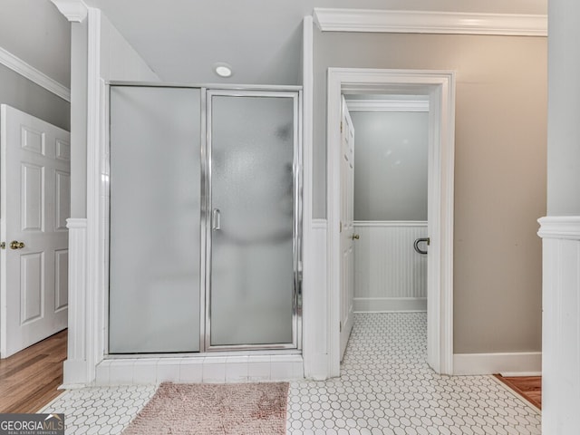646 Darlington Cir NE, Atlanta, GA 30305 - bathroom with ornamental molding, a shower stall, wainscoting, and baseboards