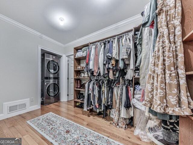 646 Darlington Cir NE, Atlanta, GA 30305 - walk in closet with estacked washer and dryer and wood finished floors