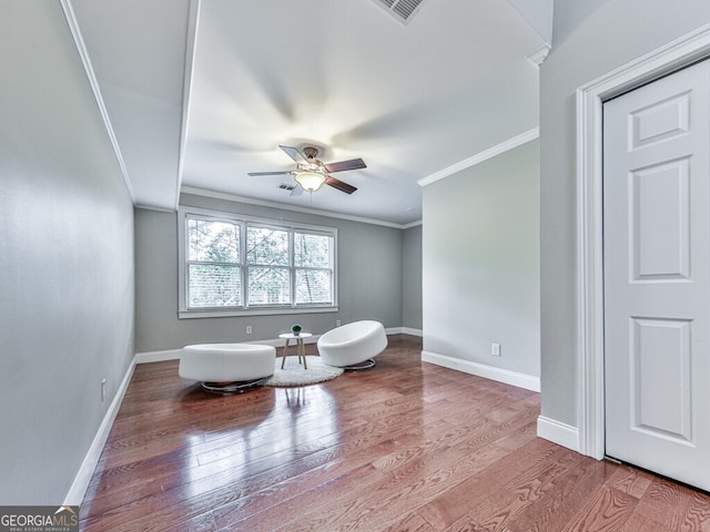 646 Darlington Cir NE, Atlanta, GA 30305 - sitting room featuring crown molding, a ceiling fan, wood finished floors, and baseboards