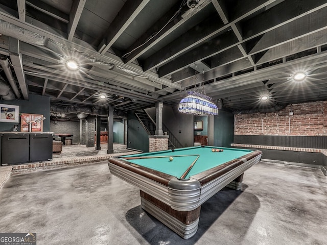 646 Darlington Cir NE, Atlanta, GA 30305 - recreation room with concrete flooring, billiards, and brick wall