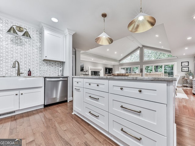 646 Darlington Cir NE, Atlanta, GA 30305 - kitchen with dishwasher, open floor plan, white cabinets, light wood-style flooring, and vaulted ceiling