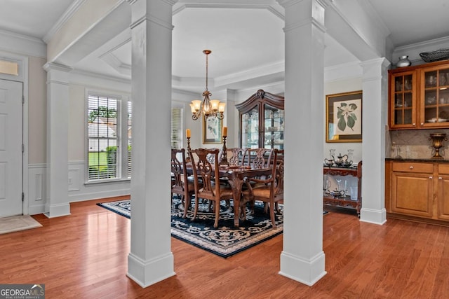 1000 Deep Water Way, Greensboro, GA 30642 - dining area with wood finished floors, decorative columns, ornamental molding, and a chandelier
