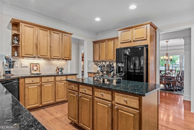 1000 Deep Water Way, Greensboro, GA 30642 - kitchen with black appliances, a chandelier, light wood-style flooring, open shelves, and backsplash