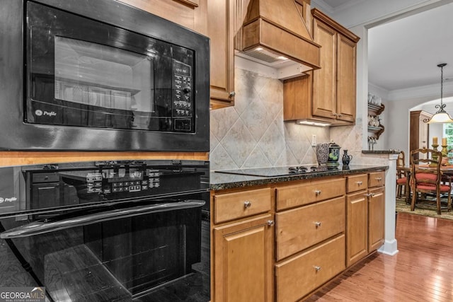 1000 Deep Water Way, Greensboro, GA 30642 - kitchen with black appliances, ornamental molding, premium range hood, arched walkways, and decorative backsplash