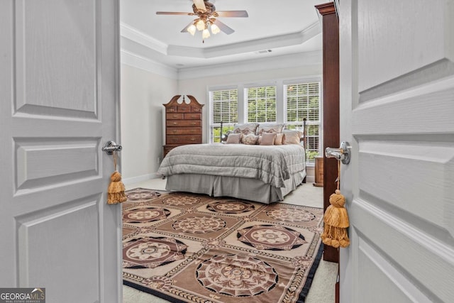 1000 Deep Water Way, Greensboro, GA 30642 - bedroom featuring crown molding, a tray ceiling, light tile patterned floors, baseboards, and a ceiling fan