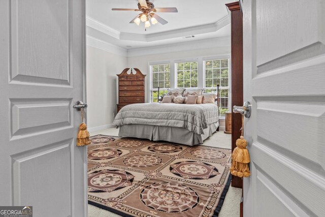 1000 Deep Water Way, Greensboro, GA 30642 - bedroom with crown molding, a raised ceiling, light tile patterned floors, and ceiling fan