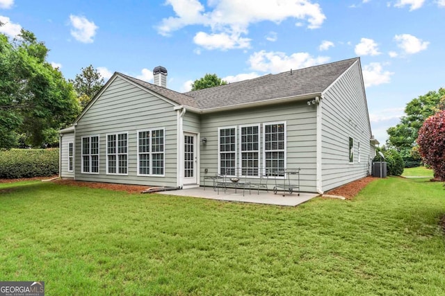 1000 Deep Water Way, Greensboro, GA 30642 - back of property featuring central AC, a patio area, a yard, roof with shingles, and a chimney