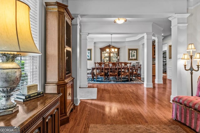 1000 Deep Water Way, Greensboro, GA 30642 - hall with dark wood-type flooring, crown molding, decorative columns, baseboards, and a chandelier