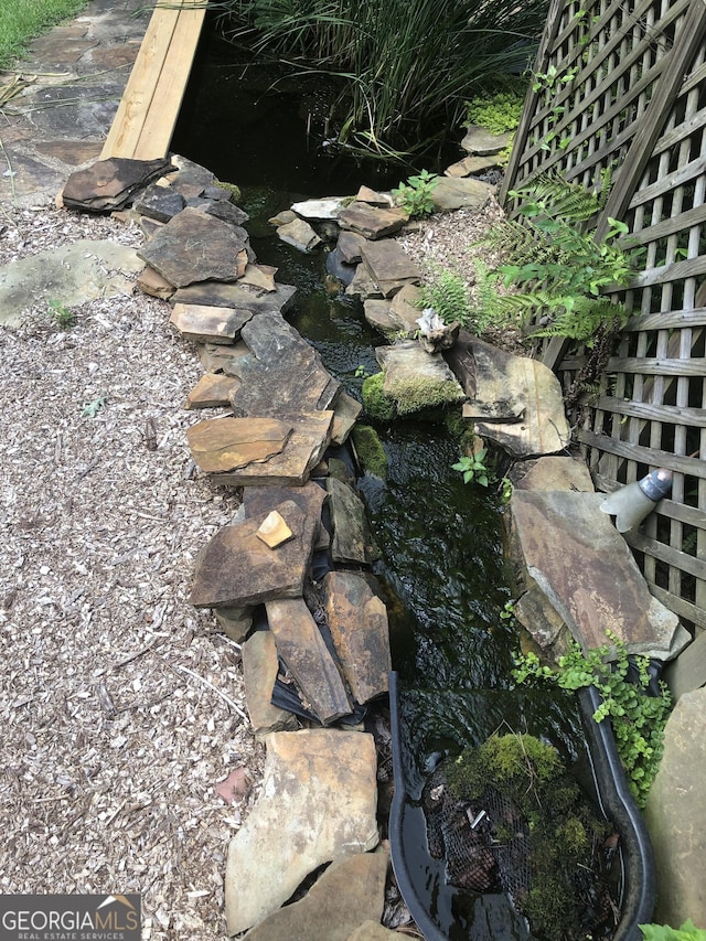 1744 Campbell Rd, Covington, GA 30014 - exterior view of a garden pond