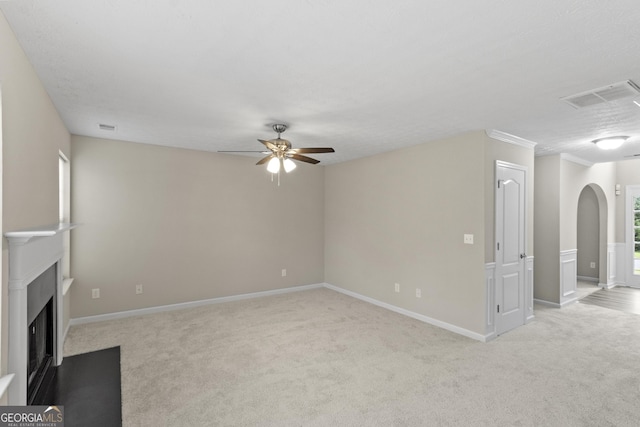 165 Heaton Place Trl, Covington, GA 30016 - unfurnished living room with light carpet, ceiling fan, baseboards, and arched walkways