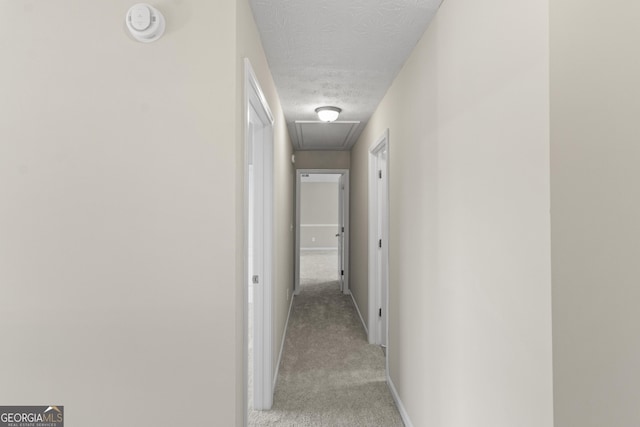 165 Heaton Place Trl, Covington, GA 30016 - hall featuring attic access, carpet flooring, baseboards, and a textured ceiling