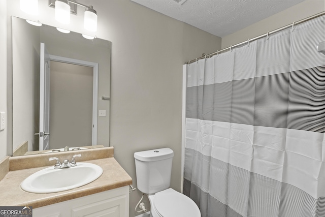 165 Heaton Place Trl, Covington, GA 30016 - bathroom featuring vanity, toilet, and a textured ceiling